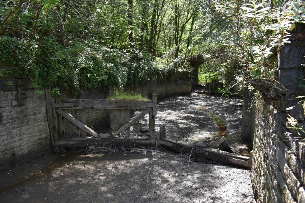 River Lock and arched bridges (background) at the tidal Red Jacket Pill