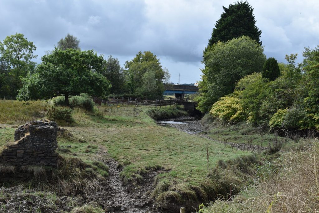 Approaching the small River Clydach aqueduct, where the river runs beneath the Tennant Canal on its journey through industrial ruins before joining the River Neath.