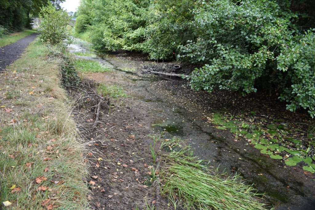 On reaching Neath Abbey, the two‑hundred‑year‑old canal collapses into a stagnant, muddy, shameful mess.
