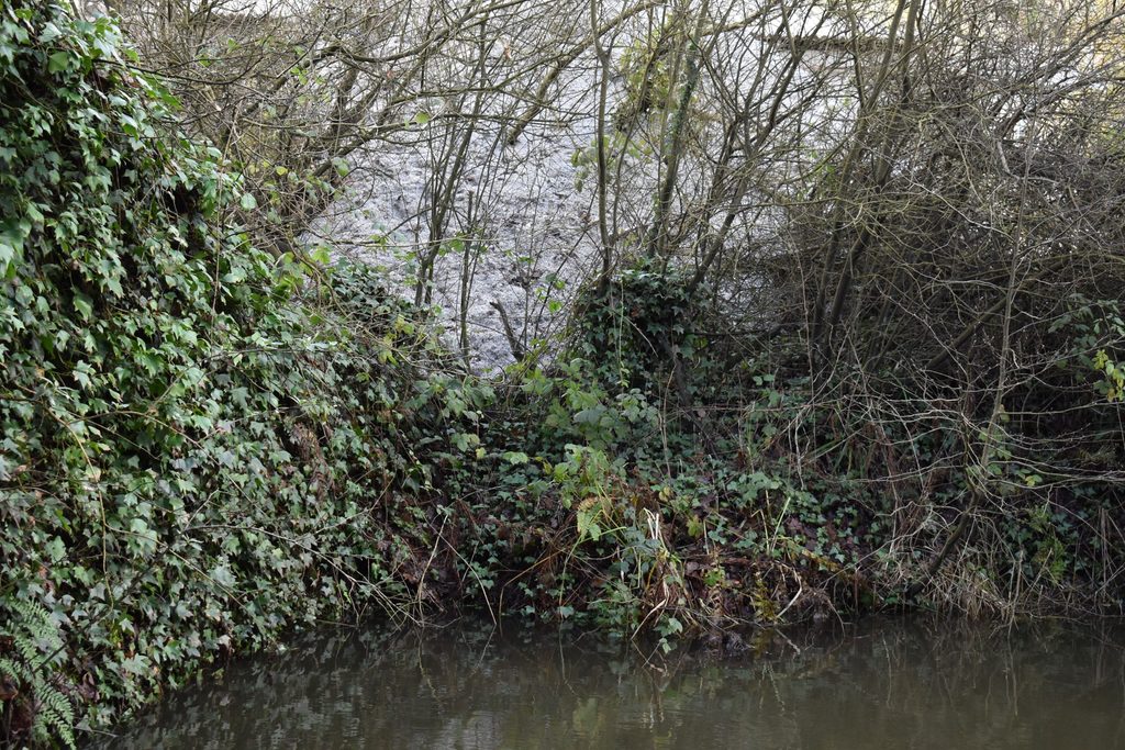 Loose plastic dust from uPVC waste piles spreading into the surrounding environment in 2023.